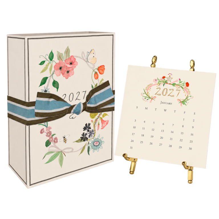 Karen Adams Designs floral calendar gift box with a striped ribbon and calendar on a brass easel.