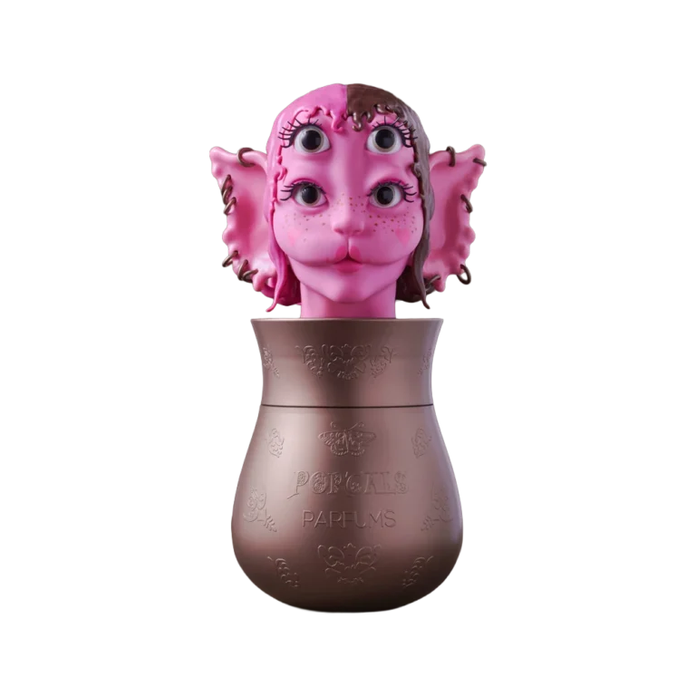 Portals Parfums Debut Collection vessel with a pink sculpted character head.
