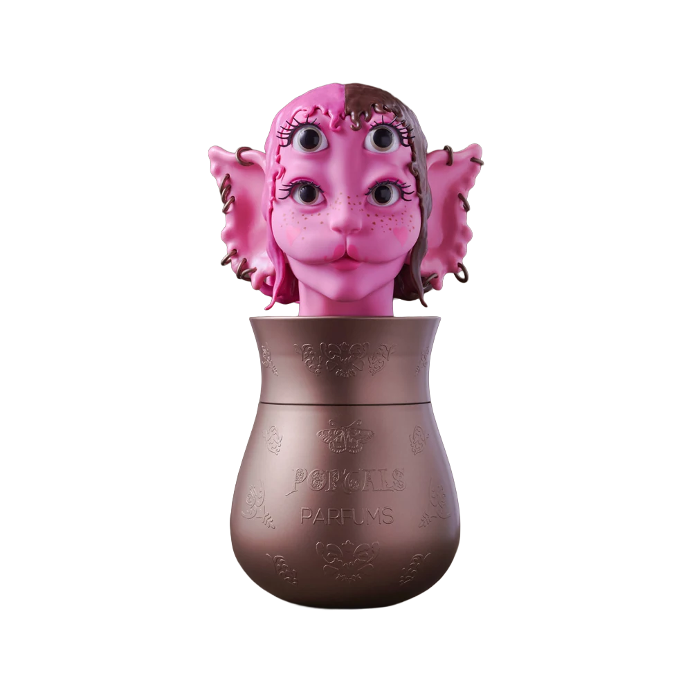 Portals Parfums Debut Collection vessel with a pink sculpted character head.