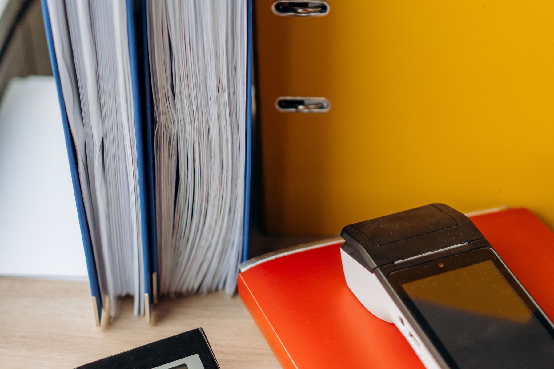 Marketing proposal files and calculator during a PPC pricing review.